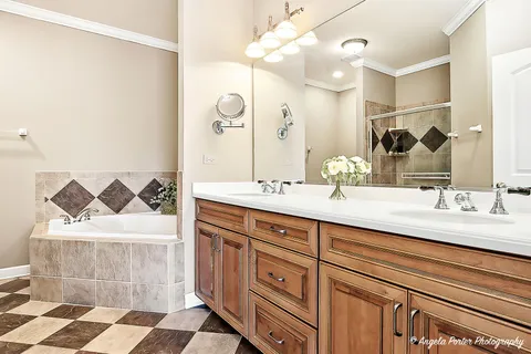 a bathroom with a double vanity sink mirror and