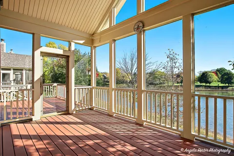 a view of a two chairs in the balcony