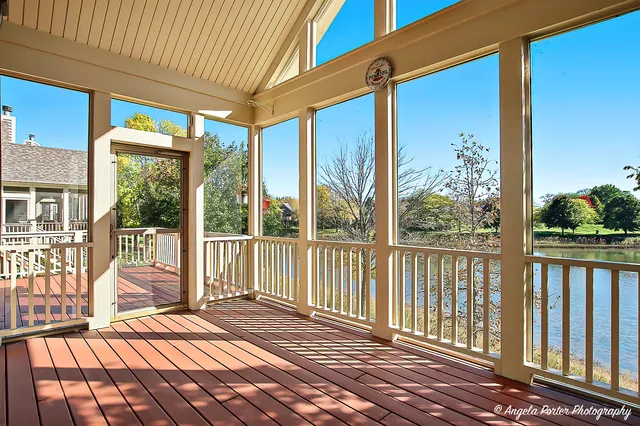 a view of a two chairs in the balcony