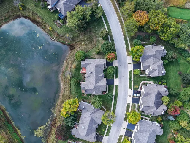 an aerial view of a house with outdoor space