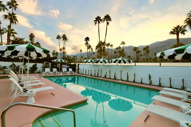 a view of a lake with a table and chairs