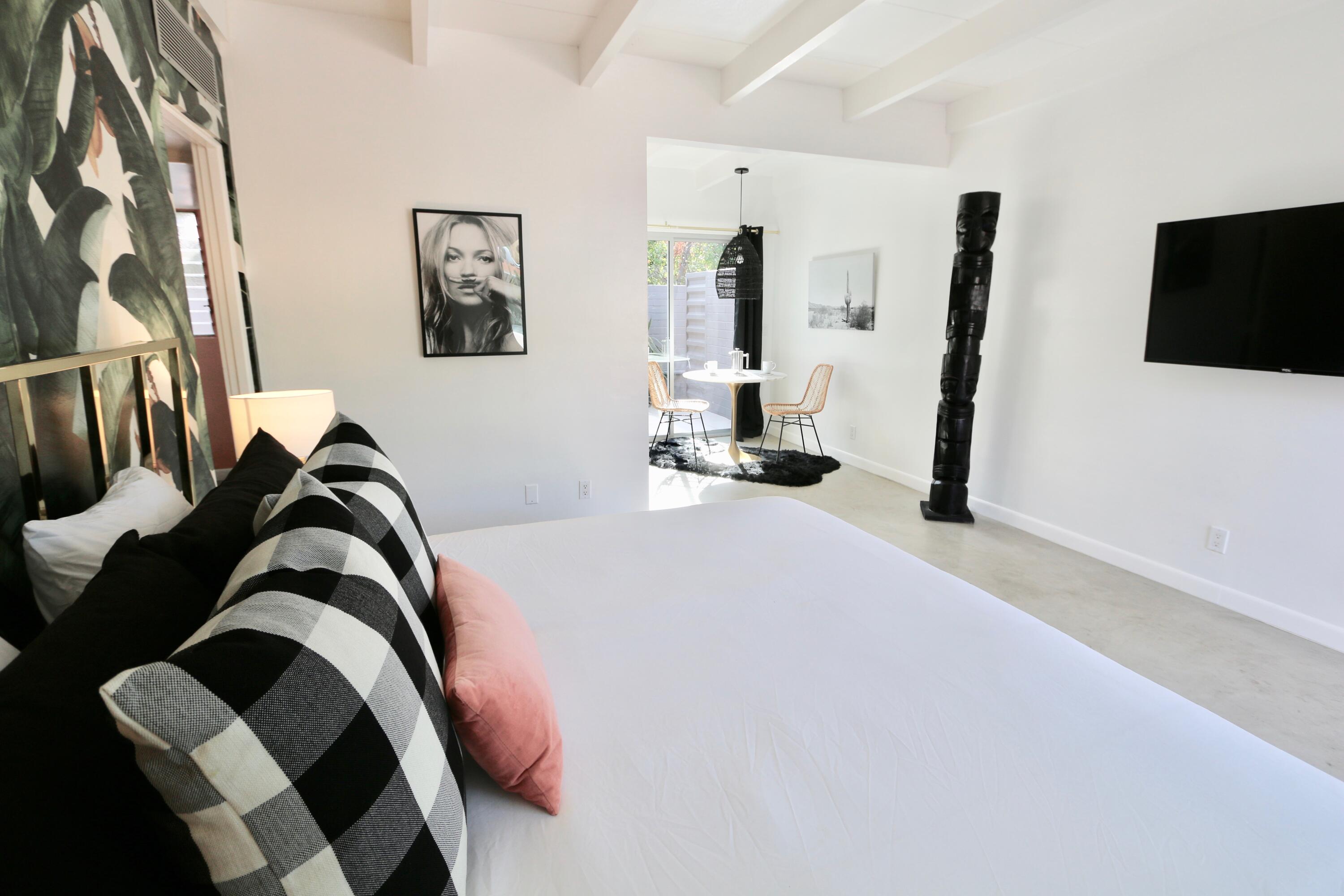 598 South Grenfall Road Palm Springs, CA 92264 - Photo 31 of 35 a bedroom with a bed and a flat tv screen on the dresser