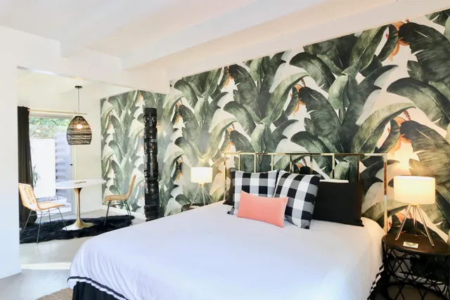 a bedroom with a bed and a couch