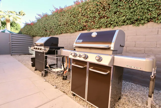 a view of a backyard with chairs