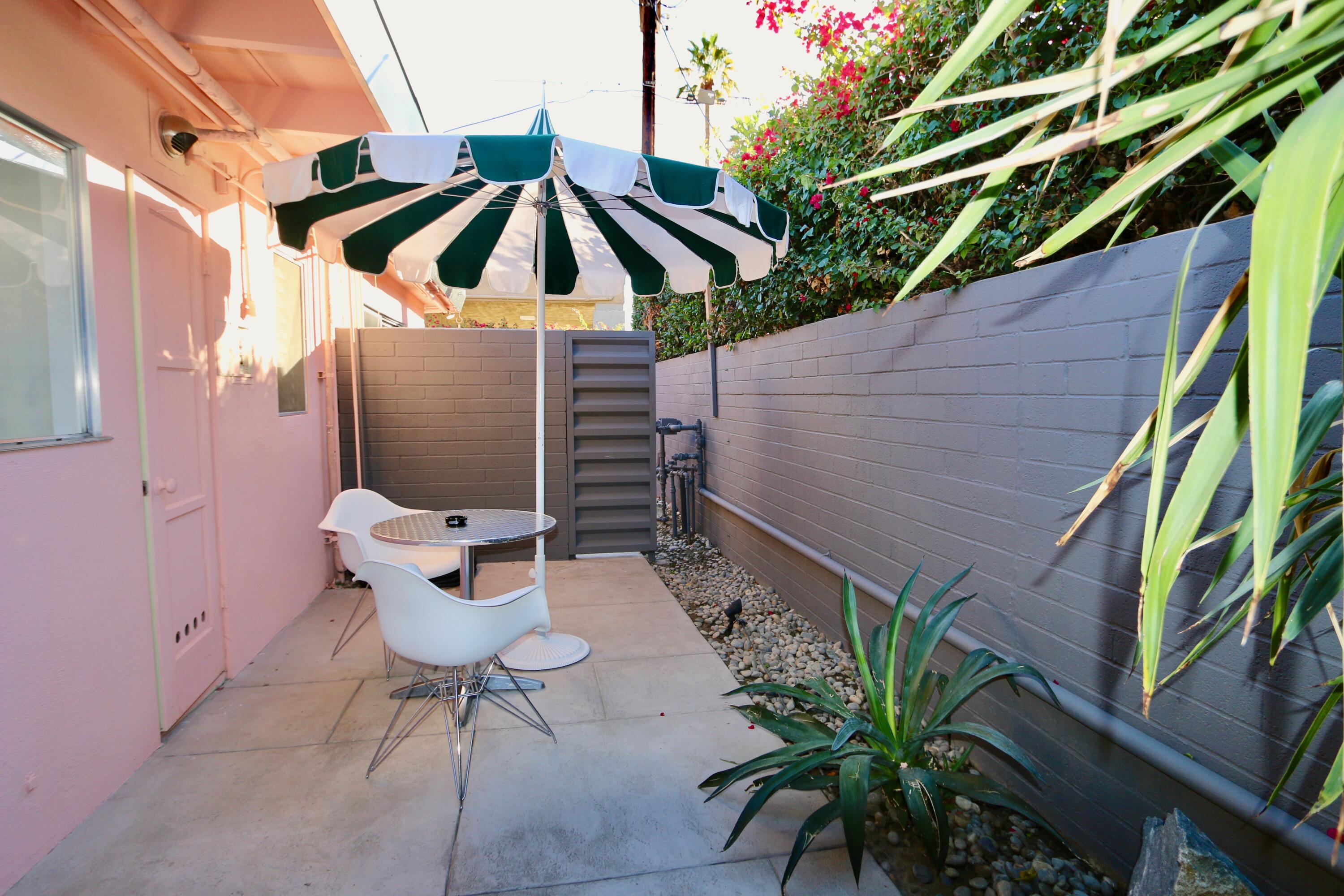598 South Grenfall Road Palm Springs, CA 92264 - Photo 7 of 35 a backyard of a house with table and chairs