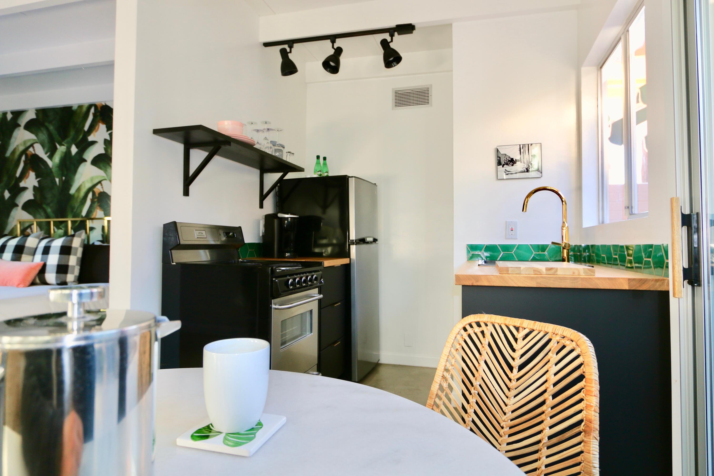 598 South Grenfall Road Palm Springs, CA 92264 - Photo 8 of 35 a dining room with furniture a fireplace and garden view