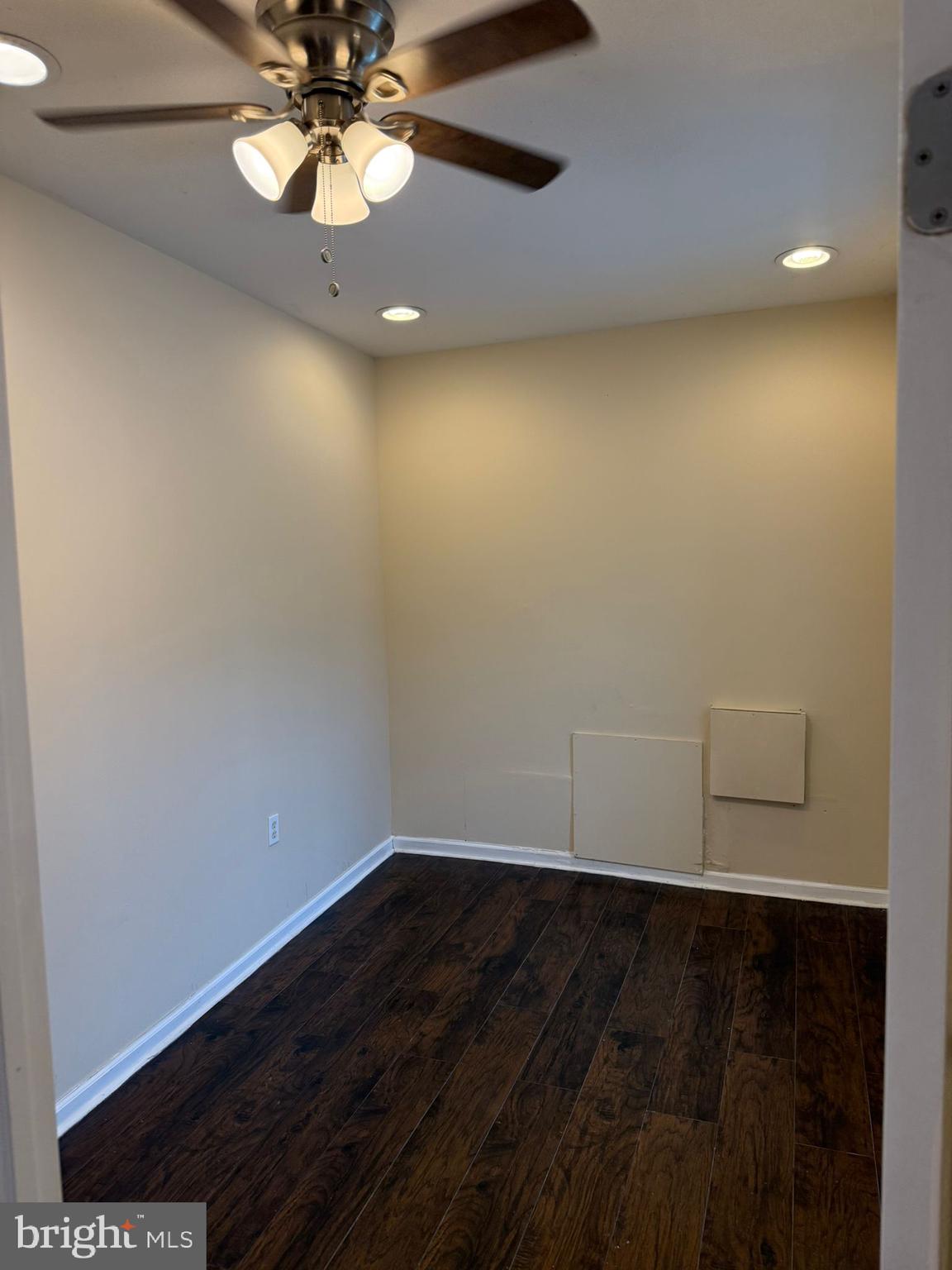 5677 Diamond Street Philadelphia, PA 19131 - Photo 6 of 7 a view of a room with wooden floor and fan
