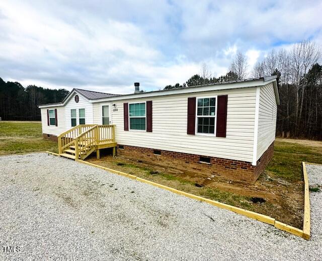1199 Adams Mountain Road Stem, NC 27581 - Photo 1 of 34 a house view with a backyard space