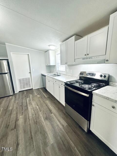 1199 Adams Mountain Road Stem, NC 27581 - Photo 16 of 34 a kitchen with granite countertop a sink and a stove top oven