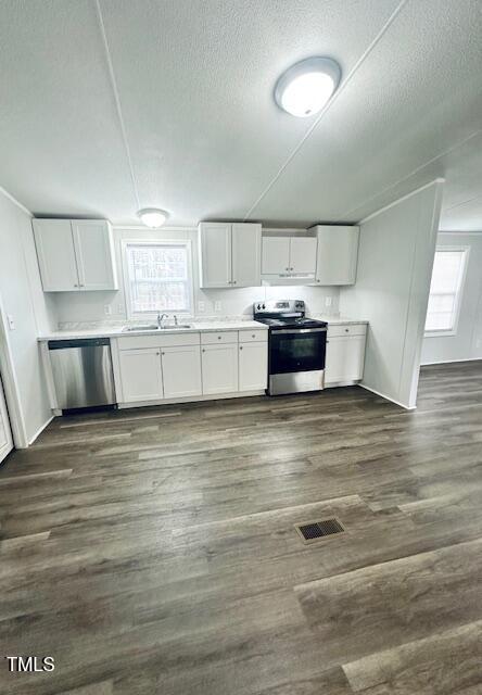 1199 Adams Mountain Road Stem, NC 27581 - Photo 20 of 34 a view of kitchen and wooden floor