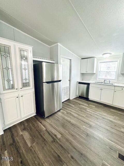 1199 Adams Mountain Road Stem, NC 27581 - Photo 23 of 34 a view of a kitchen with a stove cabinets and wooden floor