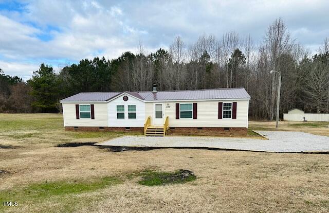 1199 Adams Mountain Road Stem, NC 27581 - Photo 3 of 34 a white house that has a tree in front of it