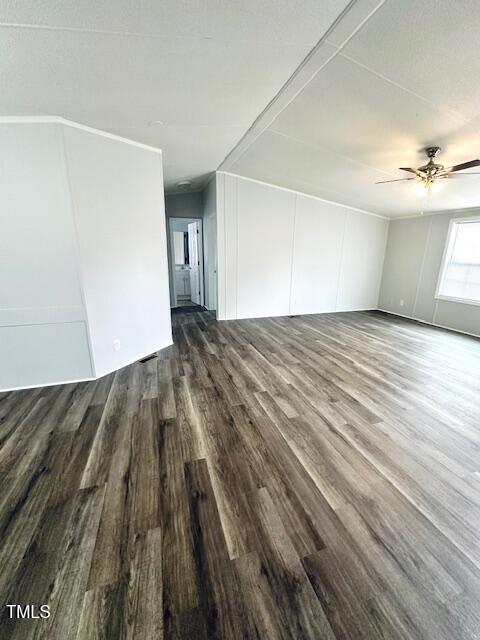 1199 Adams Mountain Road Stem, NC 27581 - Photo 34 of 34 a view of empty room with wooden floor and fan