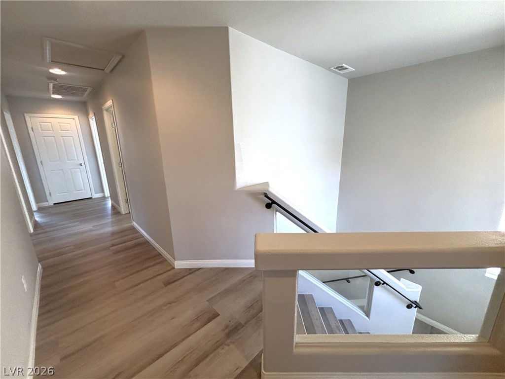 6425 Jackson Spring Road Las Vegas, NV 89118 - Photo 29 of 31 Clean lines and light-toned flooring characterize this inviting interior hallway with convenient recessed lighting.