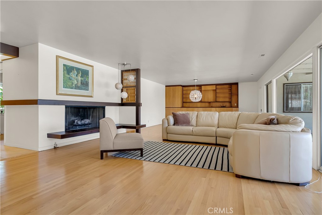 4907 Cliffside Drive Riverside, CA 92506 - Photo 11 of 29 a living room with furniture and a fireplace