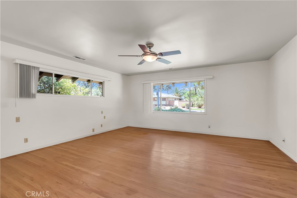 4907 Cliffside Drive Riverside, CA 92506 - Photo 15 of 29 wooden floor in an empty room with a window