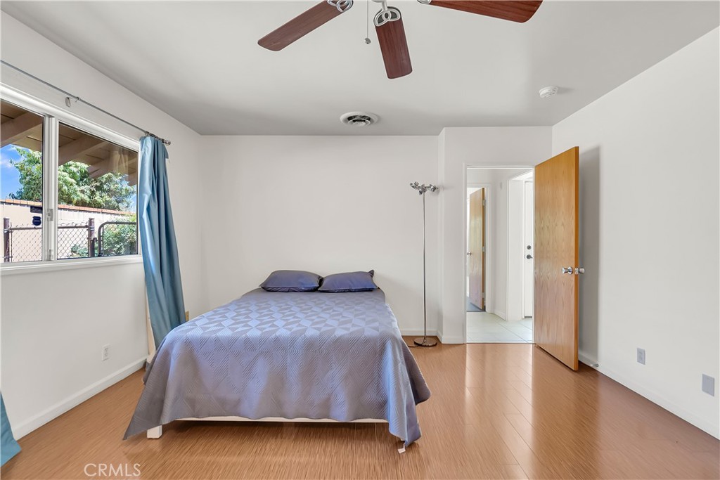 4907 Cliffside Drive Riverside, CA 92506 - Photo 19 of 29 a room with a bed and a large window