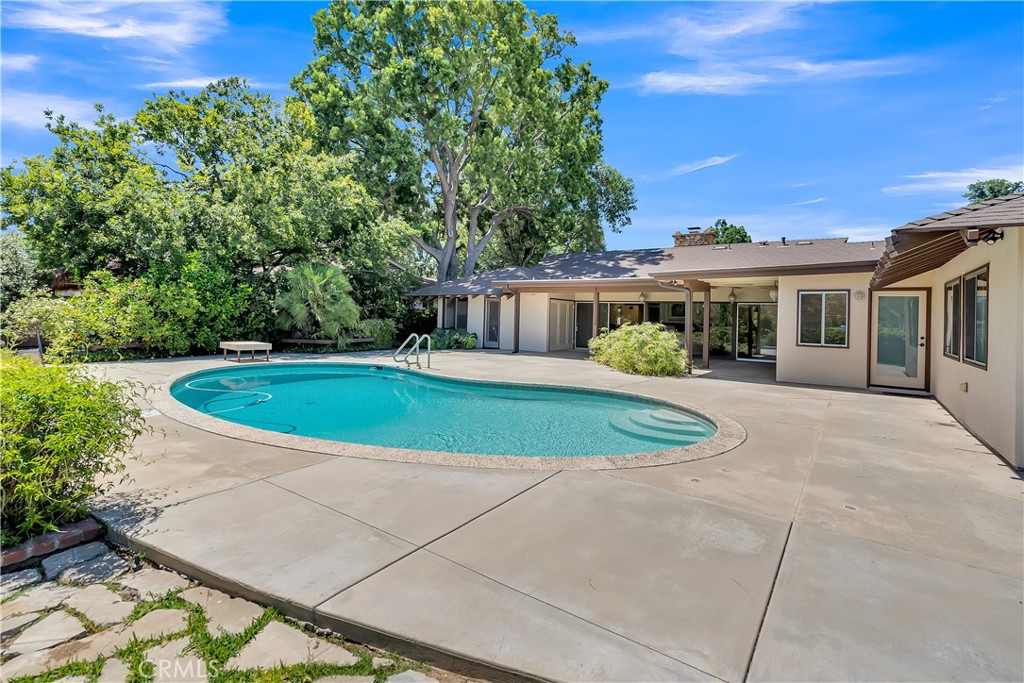 4907 Cliffside Drive Riverside, CA 92506 - Photo 25 of 29 a view of a house with a swimming pool