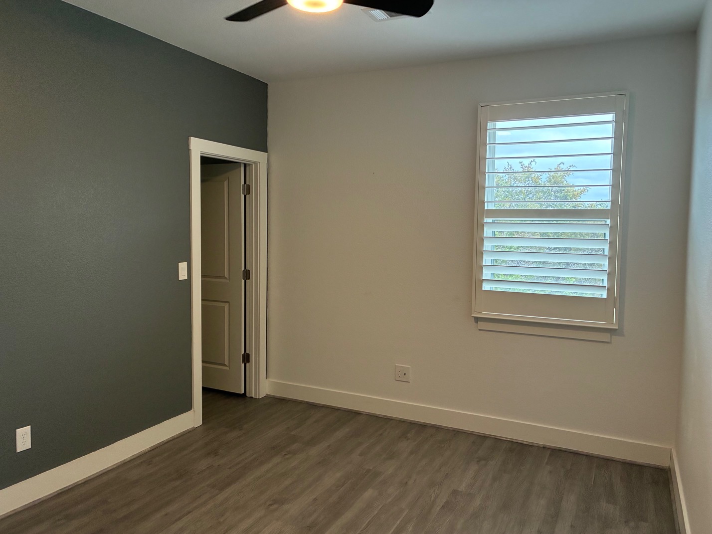 403 Summit Ridge Drive North Jonestown, TX 78645 - Photo 10 of 15 an empty room with wooden floor and windows