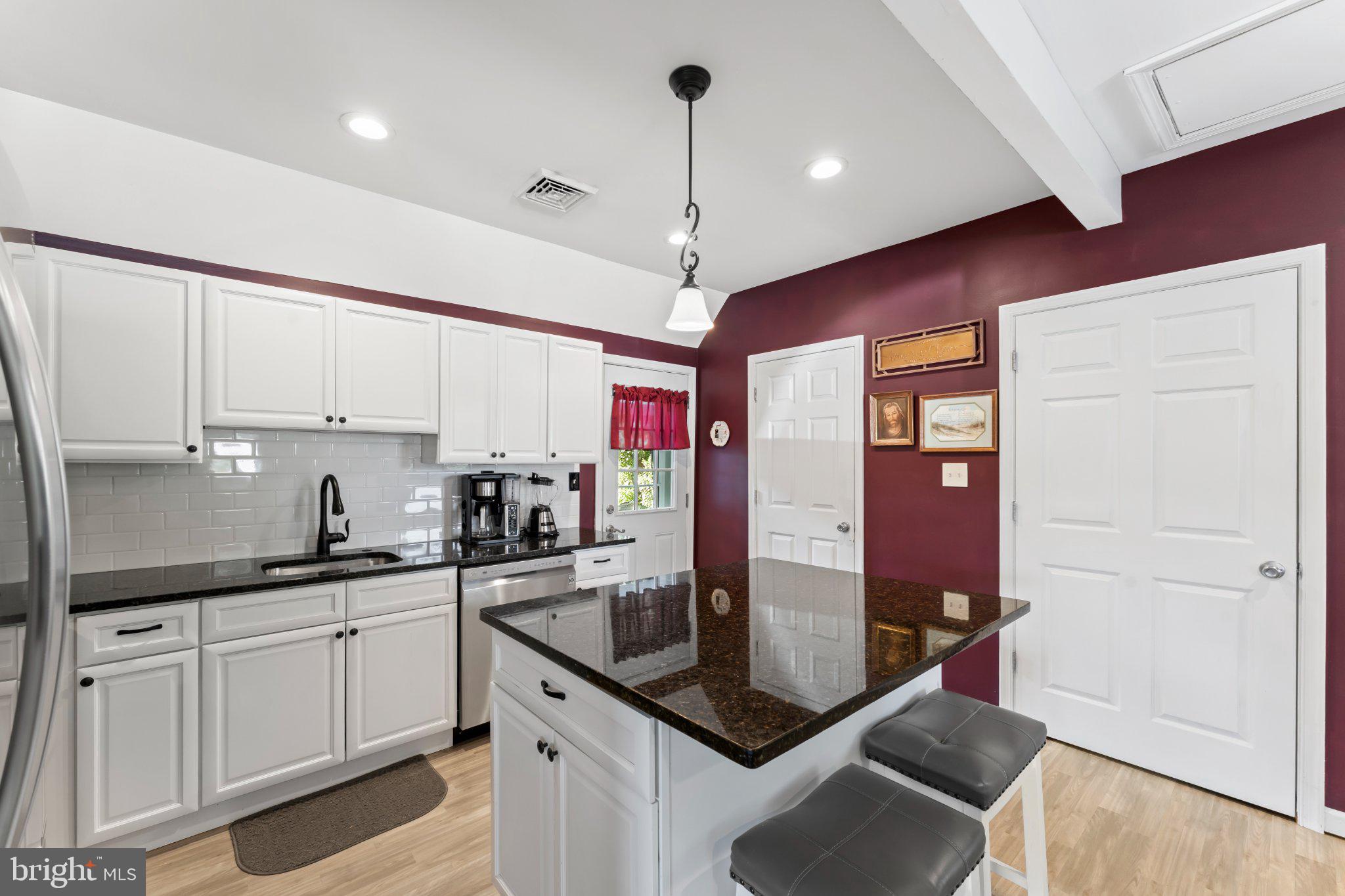 1748 Larkin Road Upper Chichester, PA 19061 - Photo 25 of 32 a kitchen with stainless steel appliances granite countertop a sink a counter space and cabinets