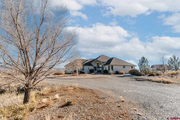 a view of a houses of snow on the road