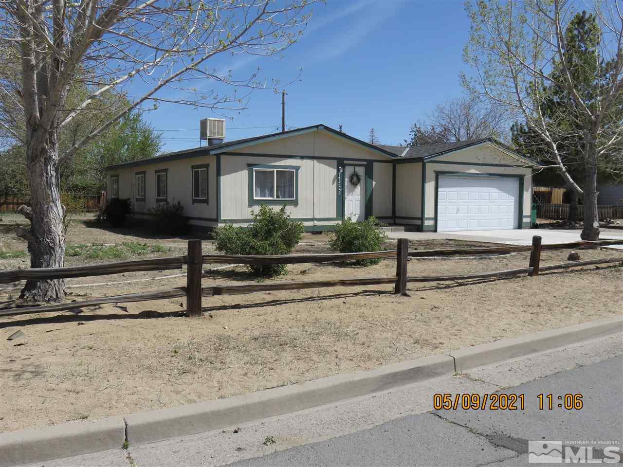 17525 Fantail Street Reno, NV 89508 - Photo 1 of 13 a front view of a house with garden