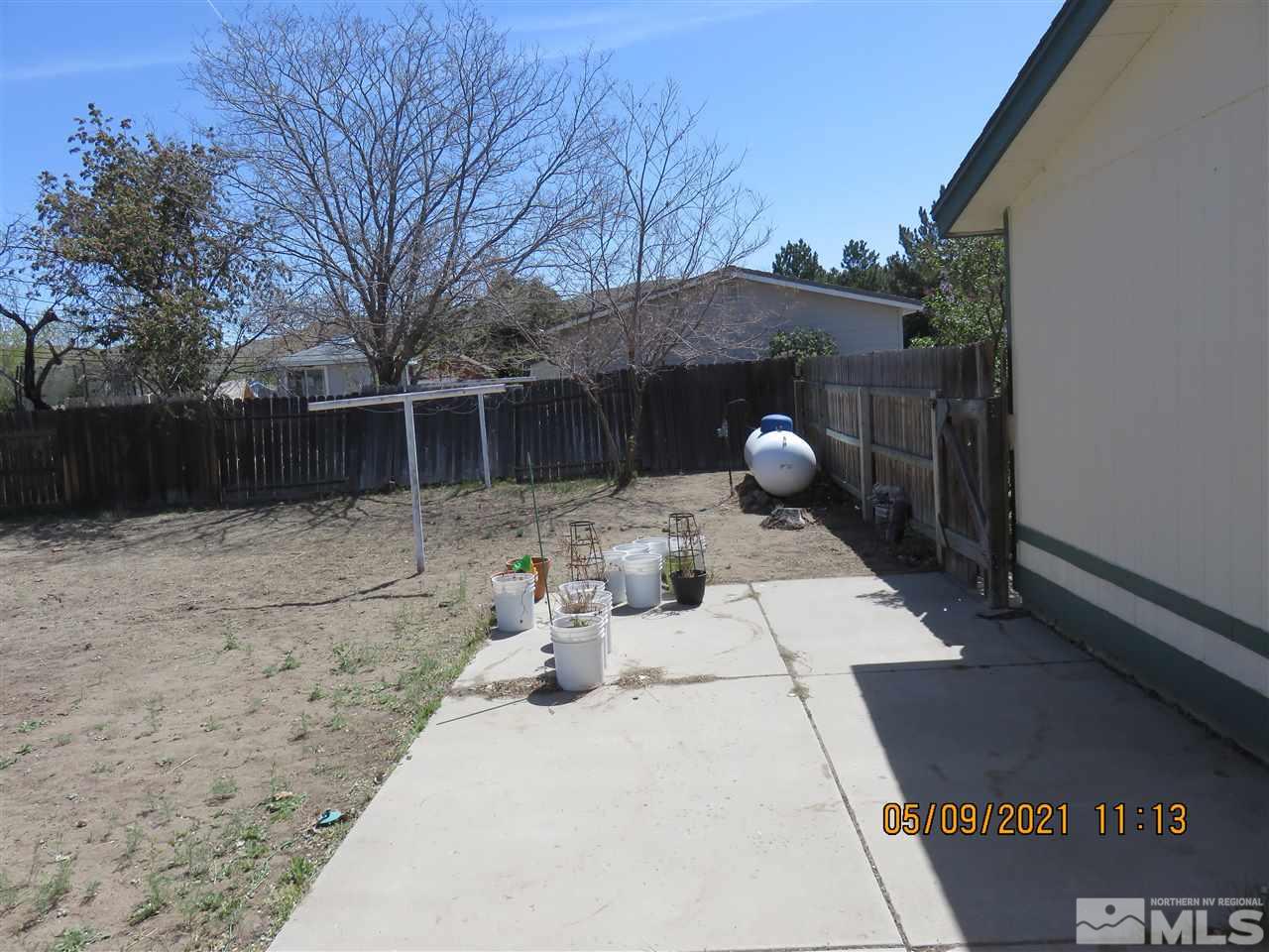 17525 Fantail Street Reno, NV 89508 - Photo 11 of 13 a view of backyard with sitting area