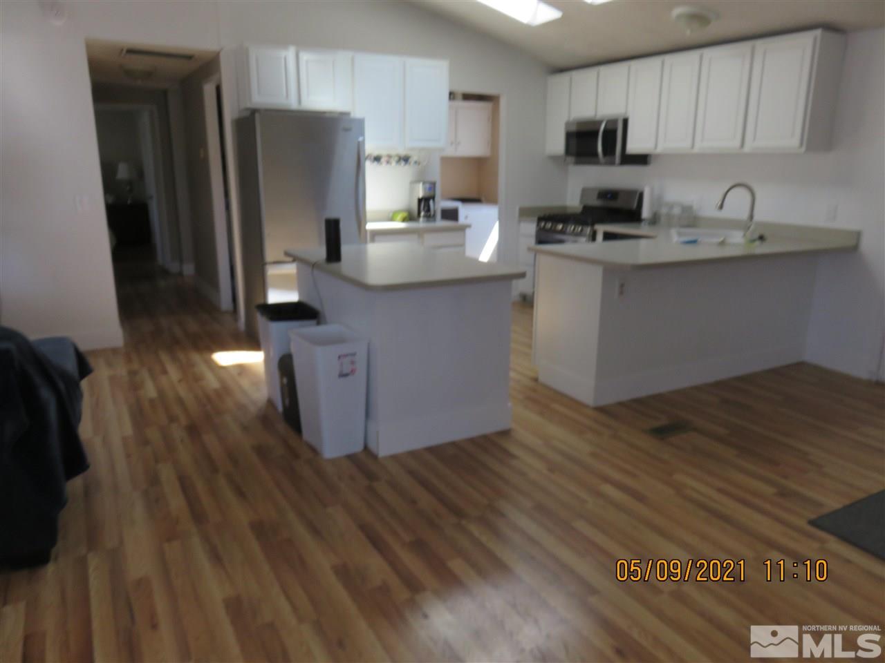 17525 Fantail Street Reno, NV 89508 - Photo 2 of 13 a kitchen with stainless steel appliances a refrigerator sink and stove