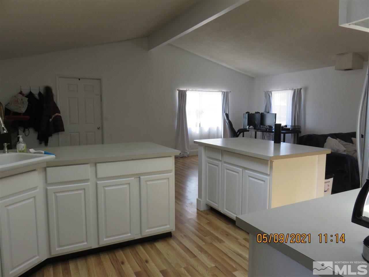 17525 Fantail Street Reno, NV 89508 - Photo 3 of 13 a kitchen with a sink and cabinets