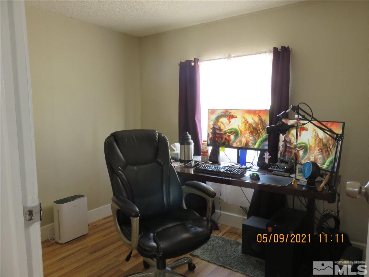 17525 Fantail Street Reno, NV 89508 - Photo 4 of 13 a view of a workspace with furniture and a window