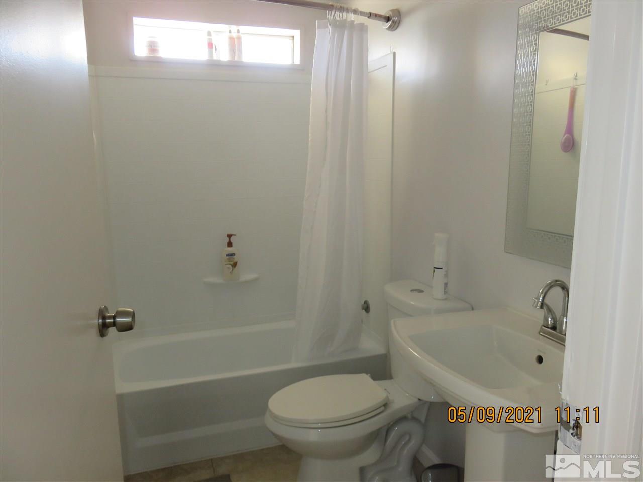 17525 Fantail Street Reno, NV 89508 - Photo 5 of 13 a bathroom with a sink toilet and shower