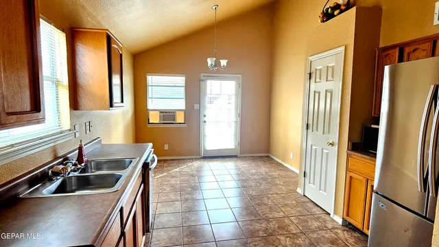 a bathroom with a granite countertop sink toilet mirror and bathtub
