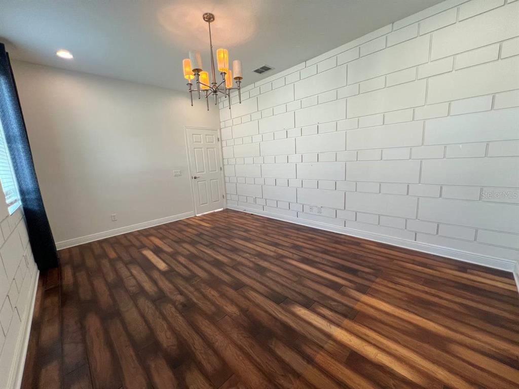 1692 Nature View Drive Lutz, FL 33558 - Photo 17 of 53 a view of a room with wooden floor and a ceiling fan