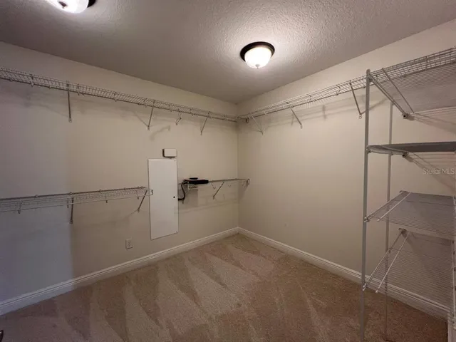 a view of a room with racks on the wall