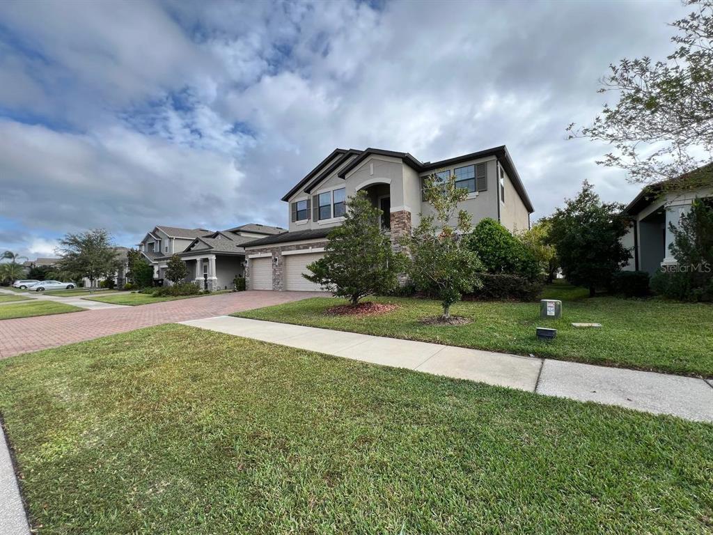 1692 Nature View Drive Lutz, FL 33558 - Photo 3 of 53 a front view of a house with a yard