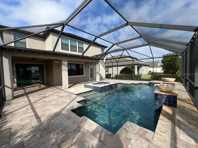 a view of a lake with a table and chairs