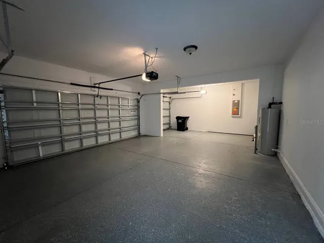 a view of a house with swimming pool and a yard