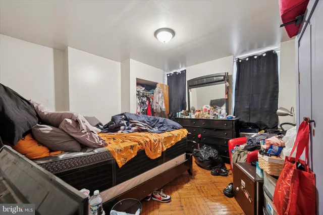 a bed room with a bed and a furniture