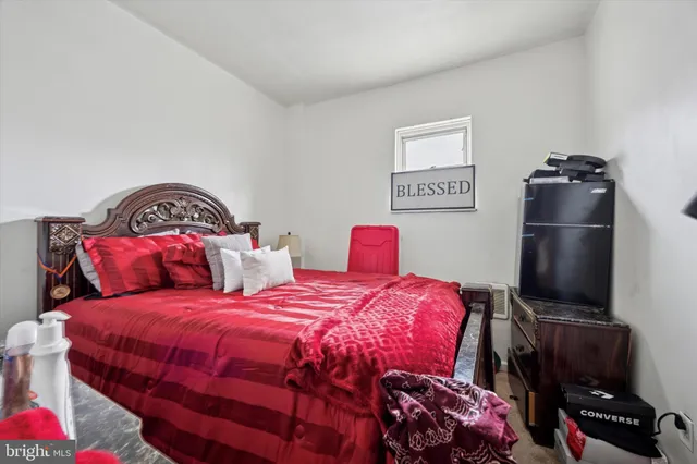 a bedroom with a bed and a closet