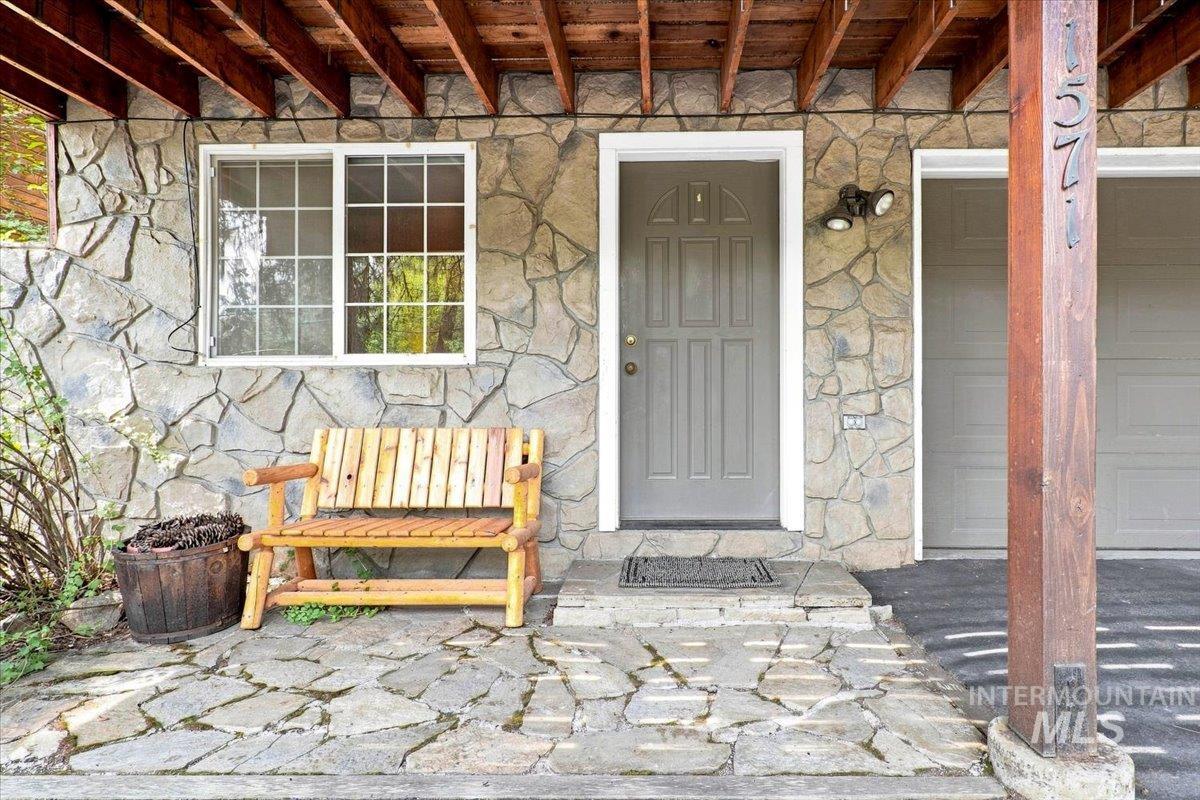 1571 Warren Wagon Road McCall, ID 83638 - Photo 38 of 50 Stone veneer exterior with a paneled entry door