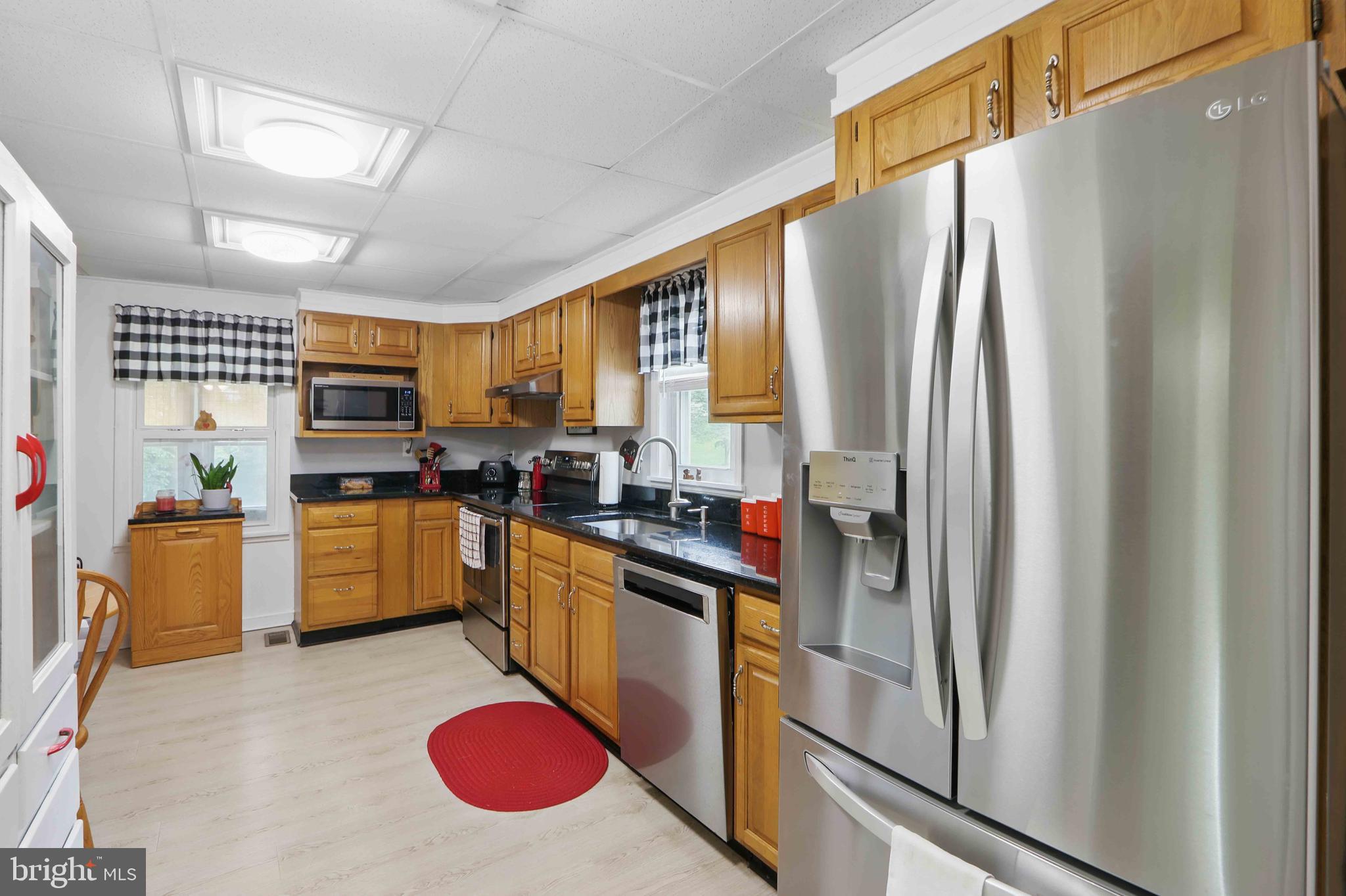147 Darlington Road Havre de Grace, MD 21078 - Photo 28 of 52 a kitchen with stainless steel appliances granite countertop a refrigerator a stove and a sink with cabinets