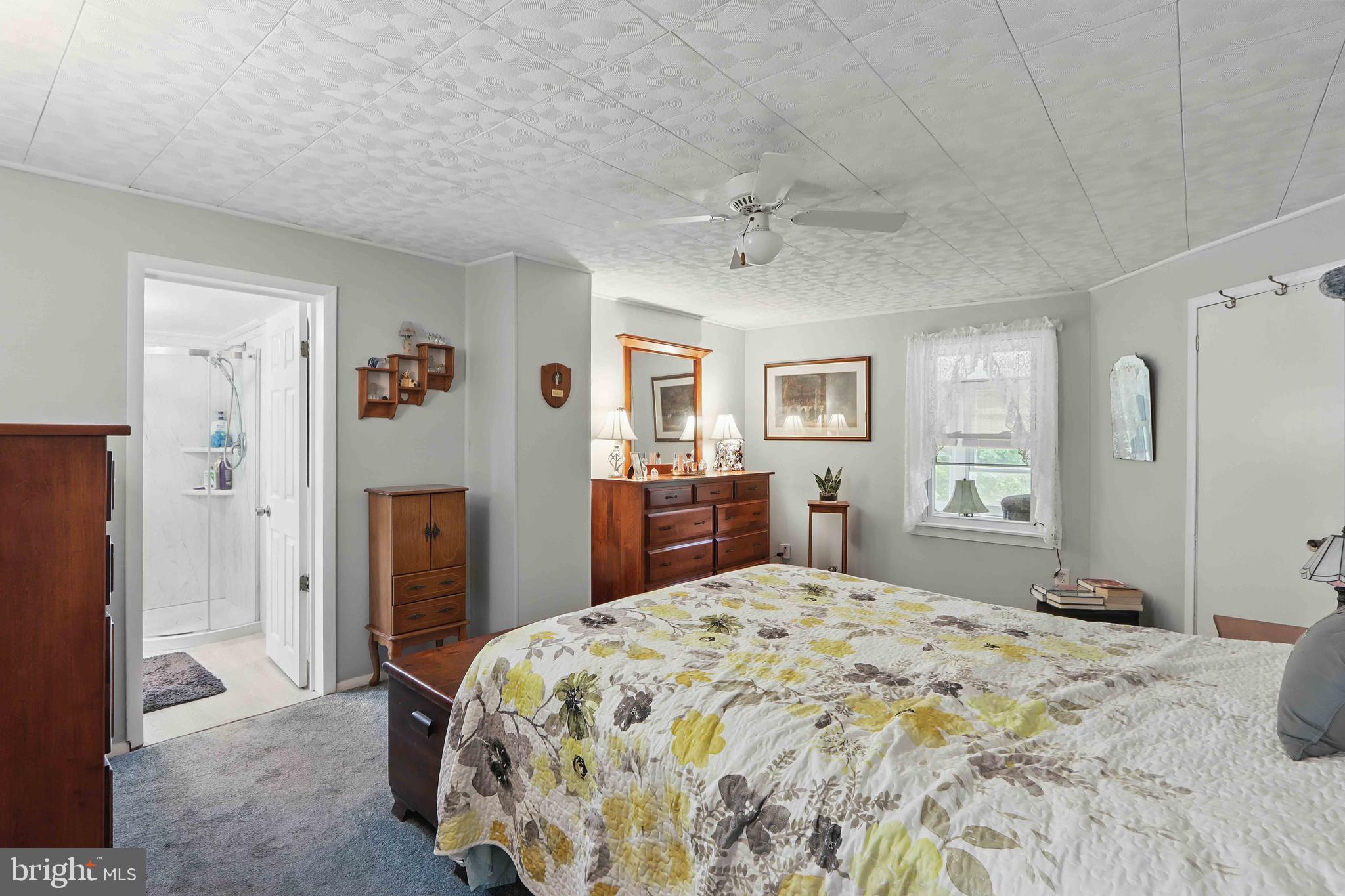 147 Darlington Road Havre de Grace, MD 21078 - Photo 32 of 52 a bedroom with a large bed and a chandelier