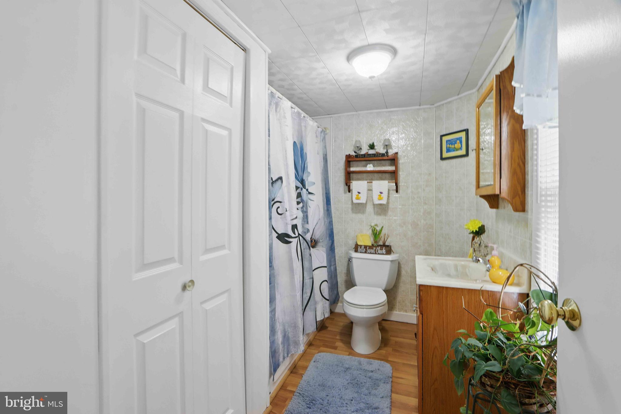 147 Darlington Road Havre de Grace, MD 21078 - Photo 42 of 52 a view of bathroom with a toilet sink and shower curtain