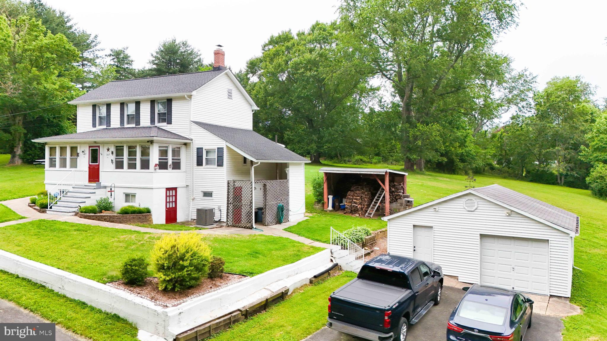 147 Darlington Road Havre de Grace, MD 21078 - Photo 7 of 52 a front view of a house with a yard table and chairs
