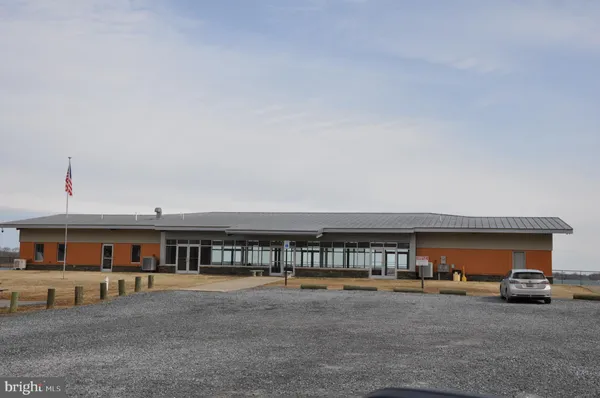a view of building with car parked