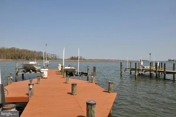 a view of ocean with a large bridge