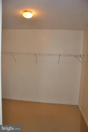 a bathroom with a shower sink and mirror