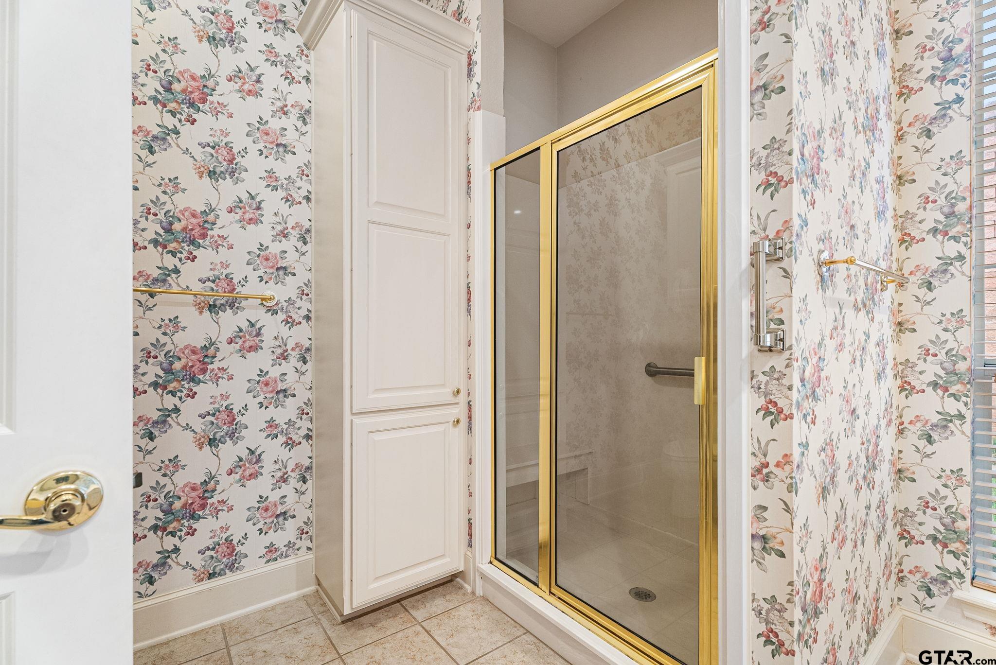 2438 Dietz Lane Tyler, TX 75701 - Photo 13 of 26 a bathroom with a shower and a sink