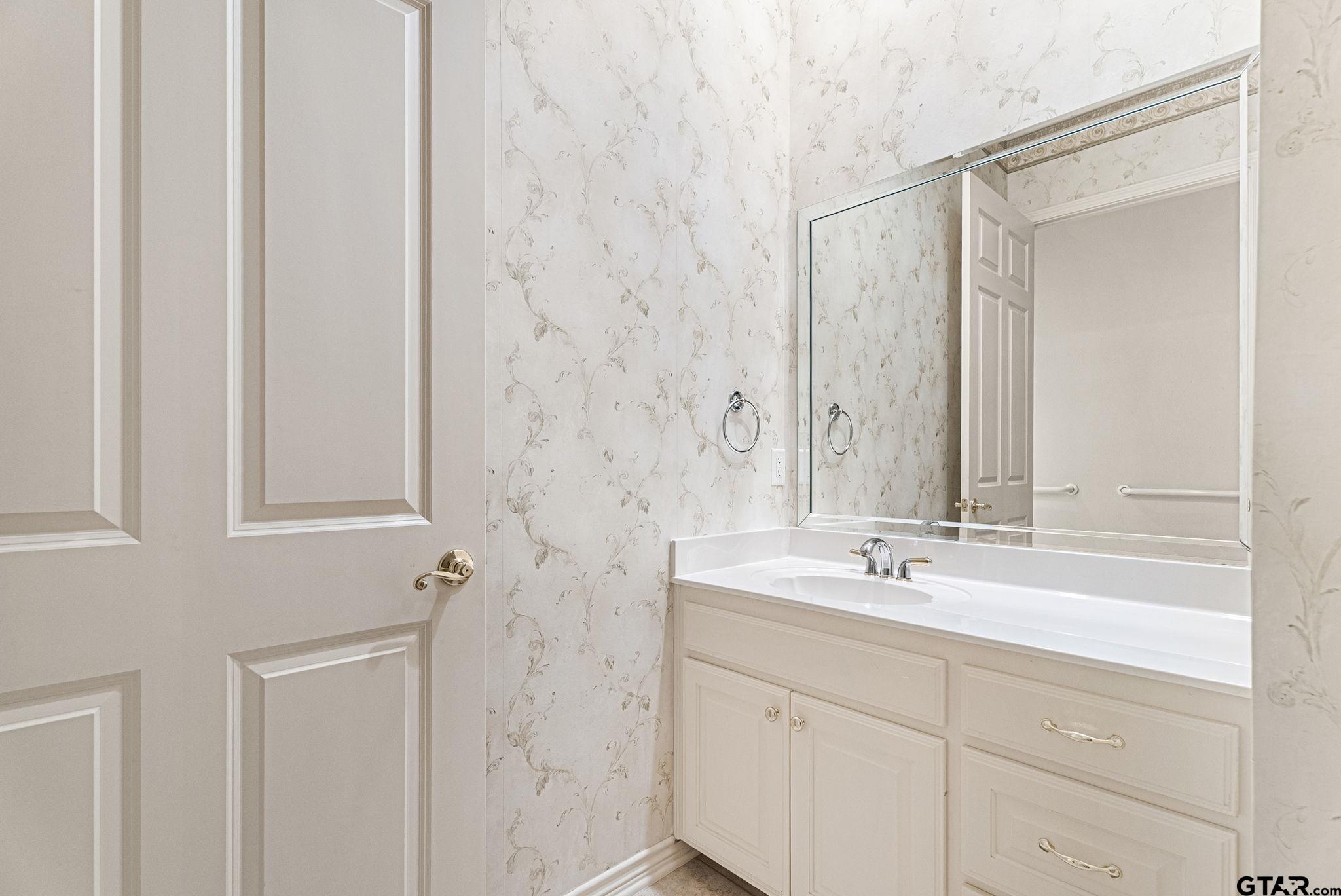 2438 Dietz Lane Tyler, TX 75701 - Photo 20 of 26 a bathroom with a double vanity sink mirror and double