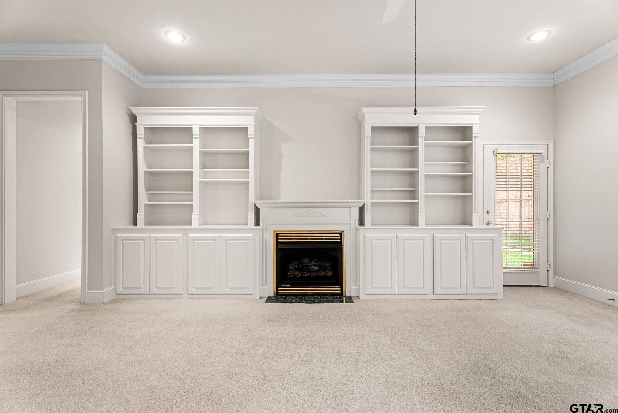 2438 Dietz Lane Tyler, TX 75701 - Photo 4 of 26 an empty room with windows and cabinet